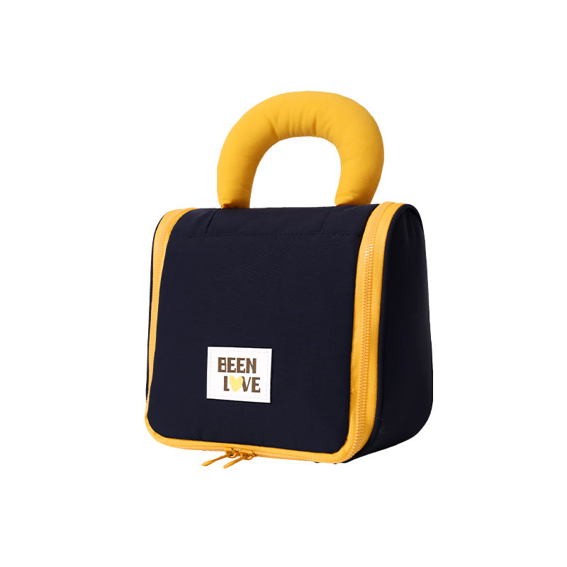 Navy hanging makeup bag with yellow handle and zip closure