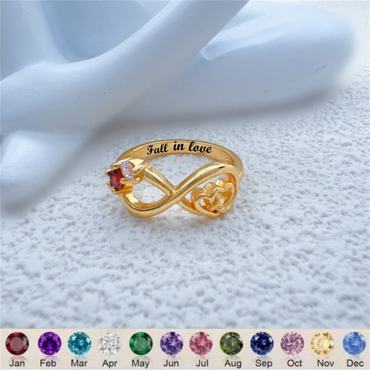 Gold-tone infinity heart ring with pink and clear stones, polished band