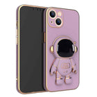 Purple phone case with 3D astronaut charm, ring grip, and dual camera cutouts