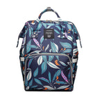 Navy leaf-print diaper backpack with front zip pocket and top carry handles