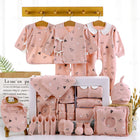 Pink newborn clothing gift set with shirts, pants, hooded pieces, socks, and receiving blanket