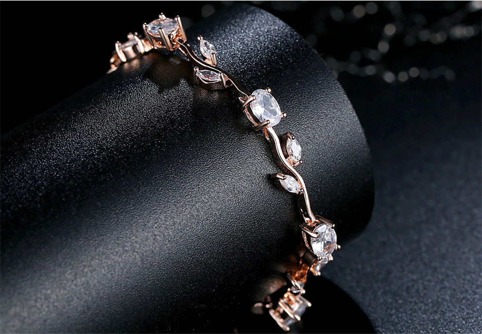 Silver-tone crystal cuff bracelet close-up with clear stones in prongs