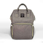 Gray maternity diaper bag with front zip pocket and top carry handles