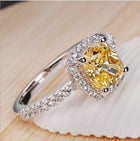 Bridal ring set with yellow cushion-cut center stone and pavé band