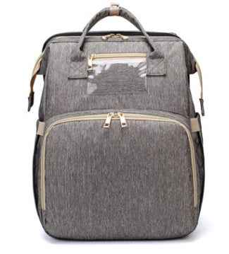 Grey foldable baby travel bed backpack with beige trim, front pocket, and gold hardware