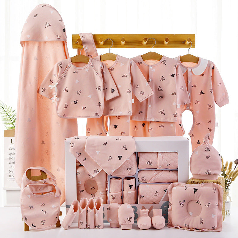 Pink newborn cotton clothing gift set with hooded outfit, bibs, socks, and blanket