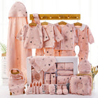 Pink newborn cotton clothing gift set with hooded outfit, bibs, socks, and blanket