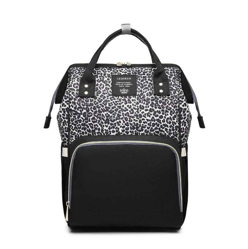 Maternity diaper bag with leopard print top and black front, two side pockets, zipper opening