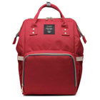 Red maternity diaper bag with front zip pocket and stitched details, top handle and side straps