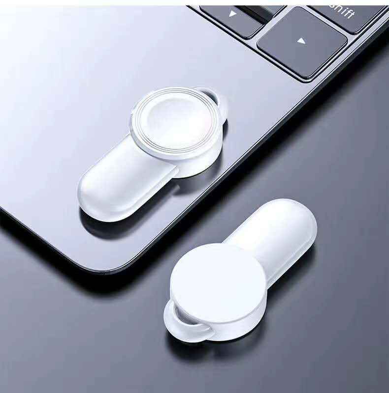 White wireless watch charger dock with magnetic circular charging plate, angled view
