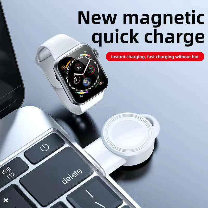 White wireless watch charger dock with magnetic charging plate, close-up with wristwatch