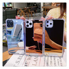 Transparent mirror iPhone case set with touch-up feature, three phones shown