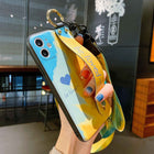 Blue and yellow iPhone case with heart print and attached wrist lanyard strap