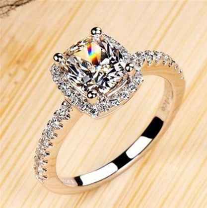 Bridal ring set with cushion-cut clear stone and pavé band