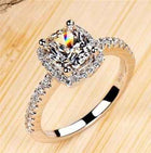 Bridal ring set with cushion-cut clear stone and pavé band