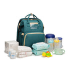Teal foldable baby travel bed backpack with baby items, bottles, and accessories shown.