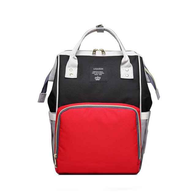 Black maternity diaper bag with red insulated front pocket, top handle and front label patch