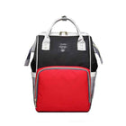 Black maternity diaper bag with red insulated front pocket, top handle and front label patch