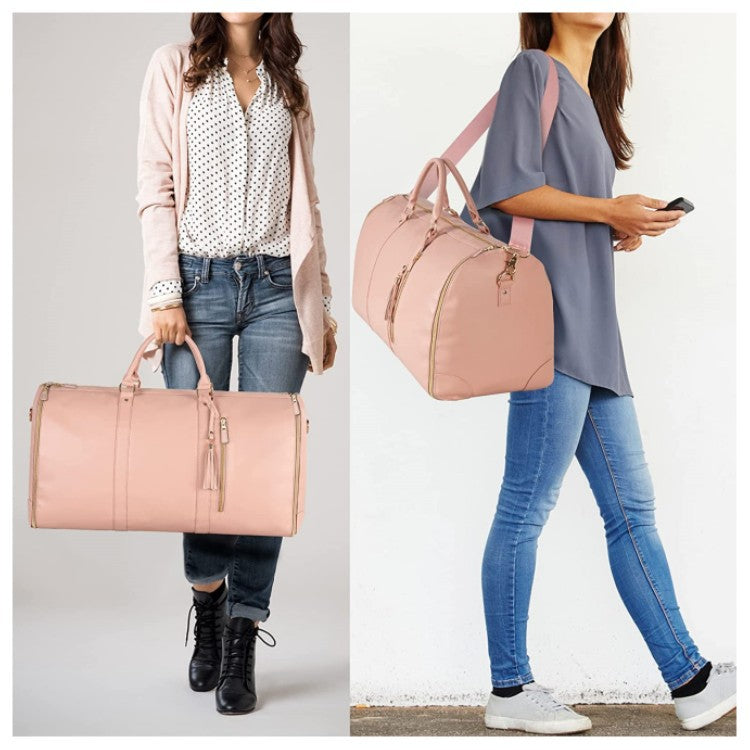Foldable pink duffle bag with top handles and long shoulder strap, zip front detail