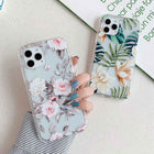 Floral iPhone phone case with pink roses and soft botanical leaves, clear protective sides