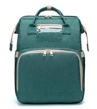 Teal green foldable baby travel bed backpack with beige trim and front double zipper