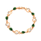 Rhinestone heart charm bracelet with emerald green stones and heart links with crystal accents