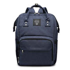 Maternity diaper bag in navy blue with front padded pocket and top carry handles