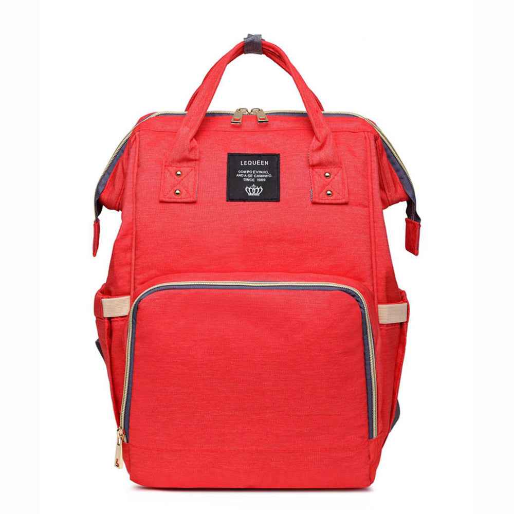 Maternity diaper bag in bright red with front zipper pocket and black-trim interior panel
