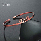 Personalized engraved stainless steel bangle bracelet, rose gold-tone with heart charm detail