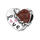 Zombie face heart charm bead pendant with brown chocolate bite mark and pink heart accents