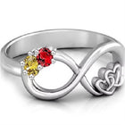Silver-tone infinity knot ring with red and yellow center stones, open design