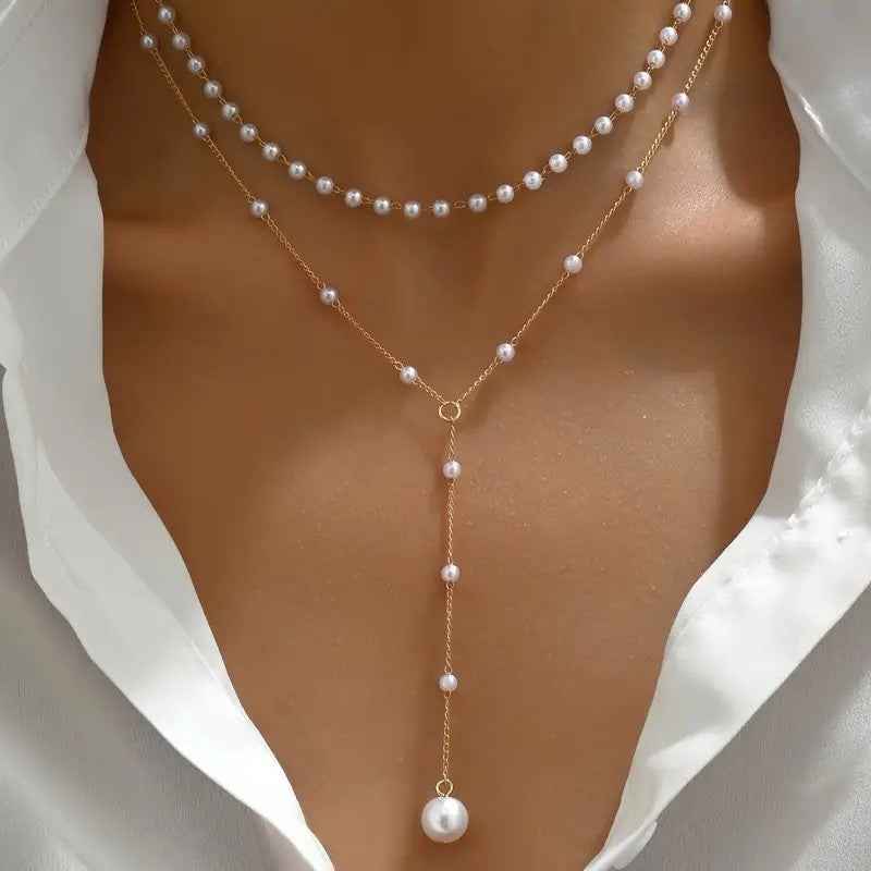 Double-layer pearl necklace with gold-tone chain and layered white pearl strands