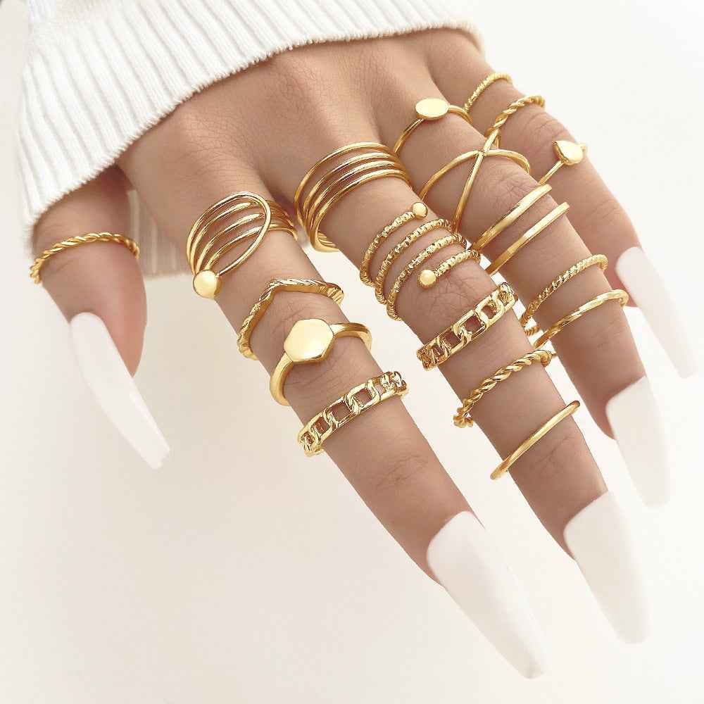 Gold heart and butterfly charm stack rings with beaded accents