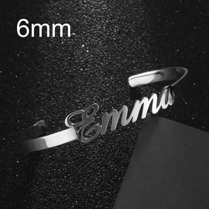 Personalized engraved stainless steel bangle bracelet, silver-tone with cursive name engraving