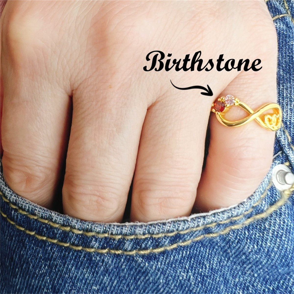Gold-tone infinity knot ring with round multicolor gemstones, slim band