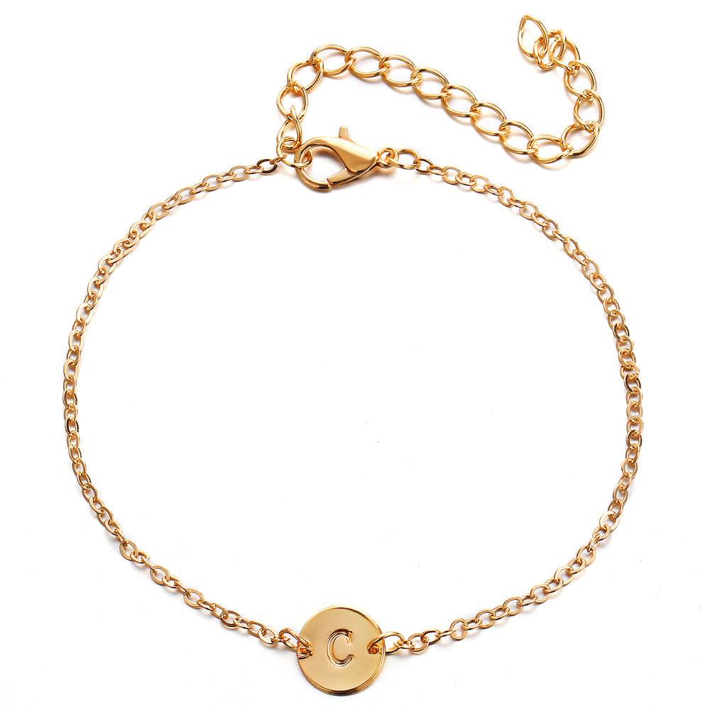 Gold-tone chain bracelet with round initial charm letter C and lobster clasp