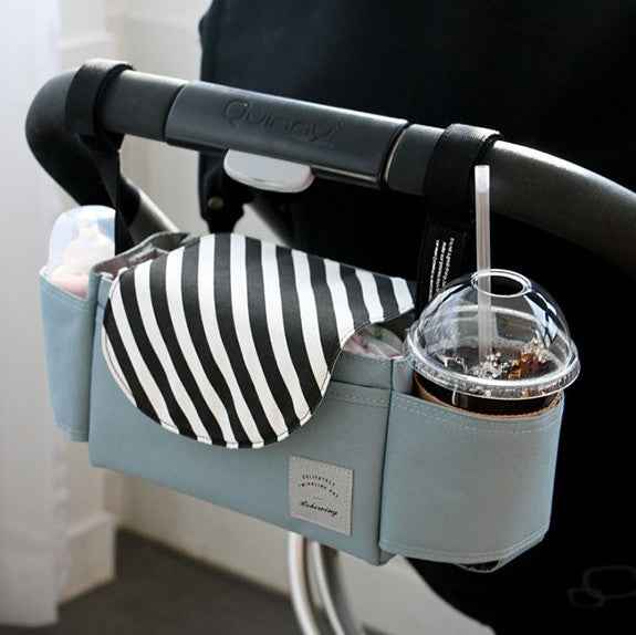 Grey stroller nappy organizer with striped pouch and clear cup holder pocket