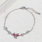 Silver chain bracelet with pink heart rhinestone center bow and adjustable clasp