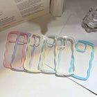 Set of transparent silicone iPhone cases with pastel wavy border trim in pink, blue, and yellow