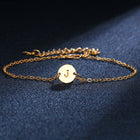 Gold-tone chain bracelet with round initial charm letter J