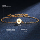 Gold-tone initial bracelet with round charm letter W