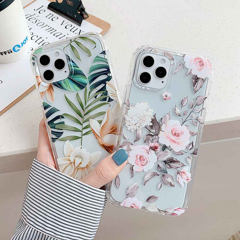 Tropical and floral iPhone cases with clear edges, held side by side