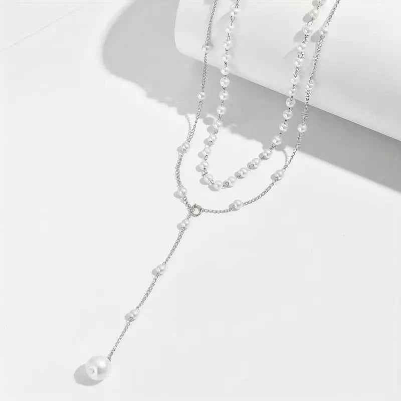 Double-layer pearl necklace with silver-tone chain and long dangling pearl