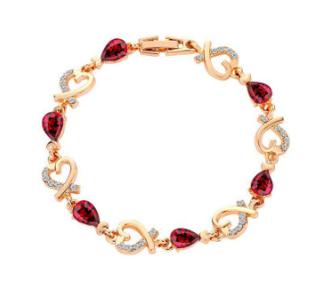 Rhinestone heart charm bracelet with deep red stones and heart links with crystal accents