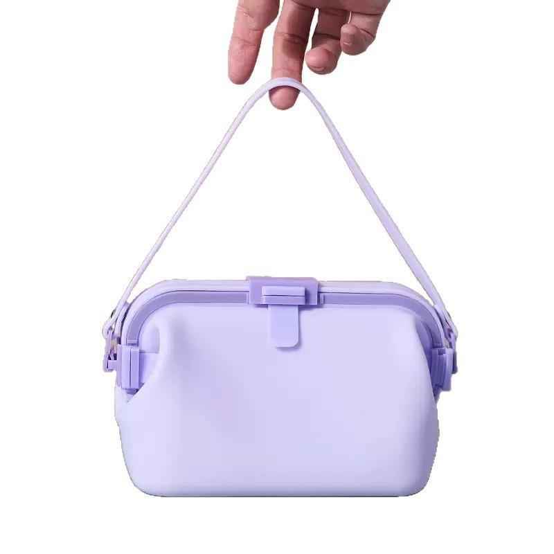 Waterproof silicone pouch in pale lavender with flip-top clasp and hanging shoulder strap