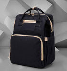 Black foldable baby travel bed backpack with front organizer panel and beige-lined edges