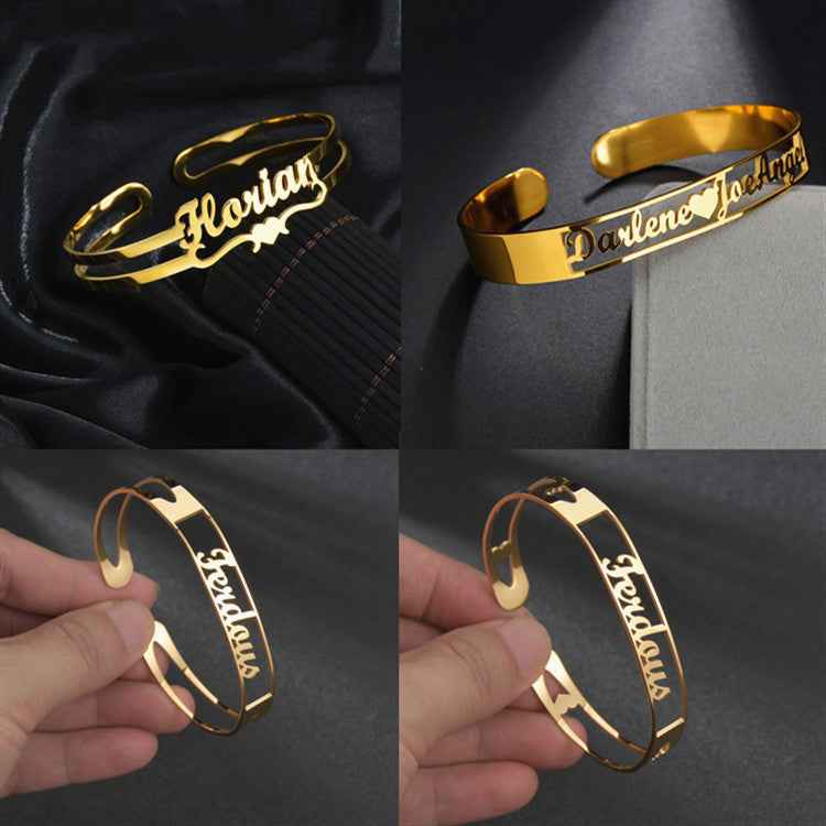 Gold personalized cuff bracelet with engraved cursive name, worn on wrist