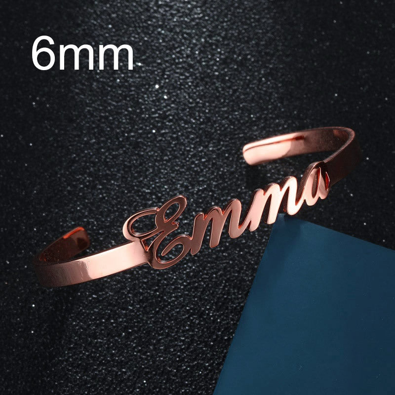 Personalized engraved stainless steel bangle bracelet, rose gold-tone with cursive name engraving