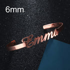 Personalized engraved stainless steel bangle bracelet, rose gold-tone with cursive name engraving