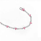 Silver chain bracelet with pink heart charms and rhinestone accents, adjustable clasp
